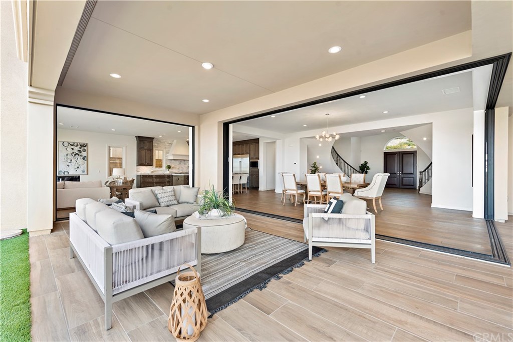 186 Leafy Pass Irvine, CA 92602 - Photo 29 of 59 a living room with furniture and a wooden floor