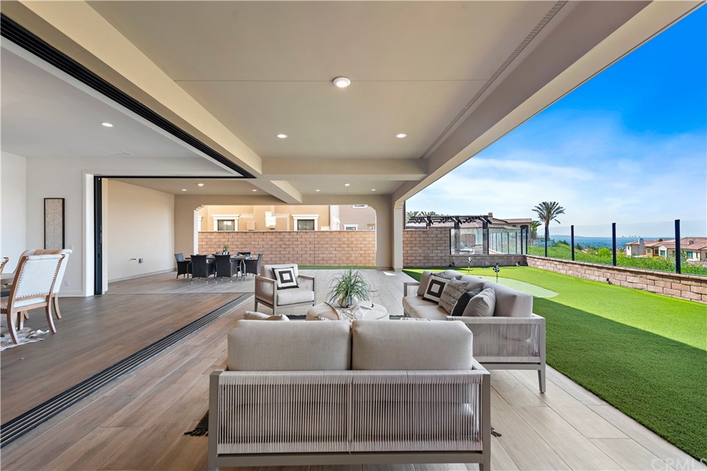186 Leafy Pass Irvine, CA 92602 - Photo 31 of 59 a living room with floor to ceiling pool table and chairs