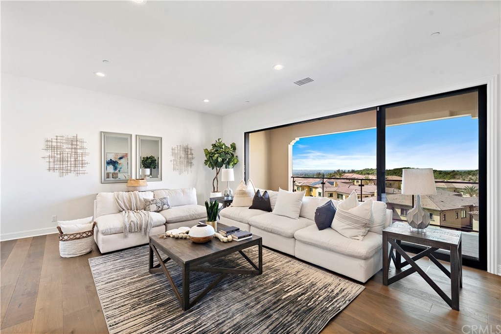186 Leafy Pass Irvine, CA 92602 - Photo 38 of 59 a living room with furniture and a large window