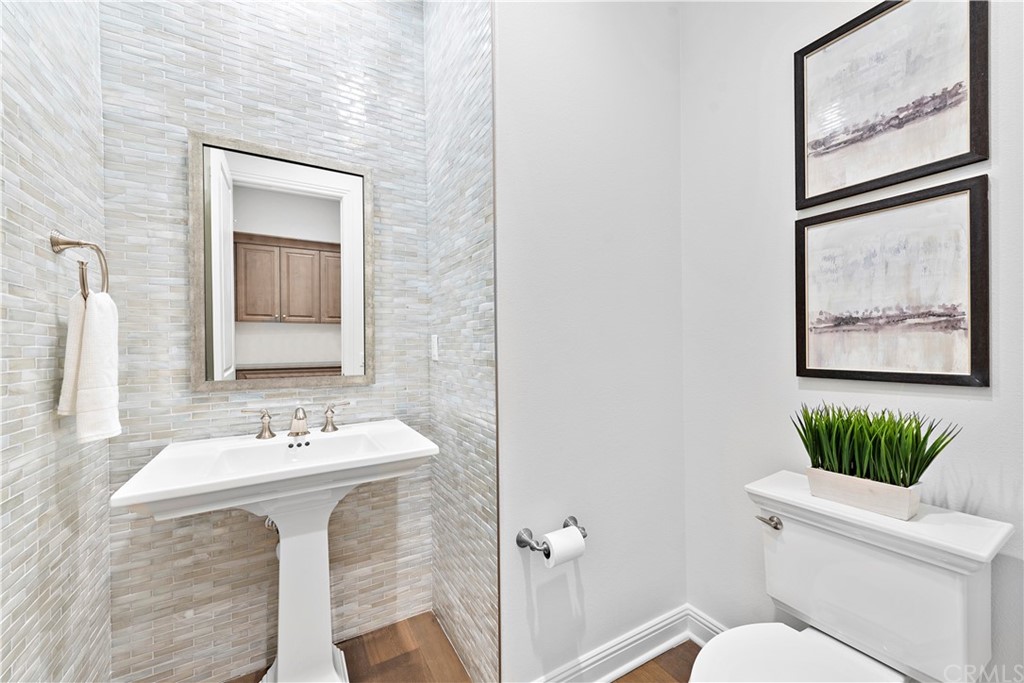 186 Leafy Pass Irvine, CA 92602 - Photo 5 of 59 a bathroom with a sink mirror and toilet