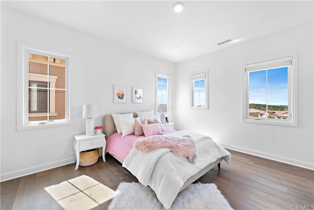 186 Leafy Pass Irvine, CA 92602 - Photo 41 of 59 a bedroom with a bed and a window