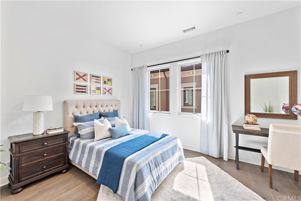 186 Leafy Pass Irvine, CA 92602 - Photo 43 of 59 a bedroom with a bed and a desk