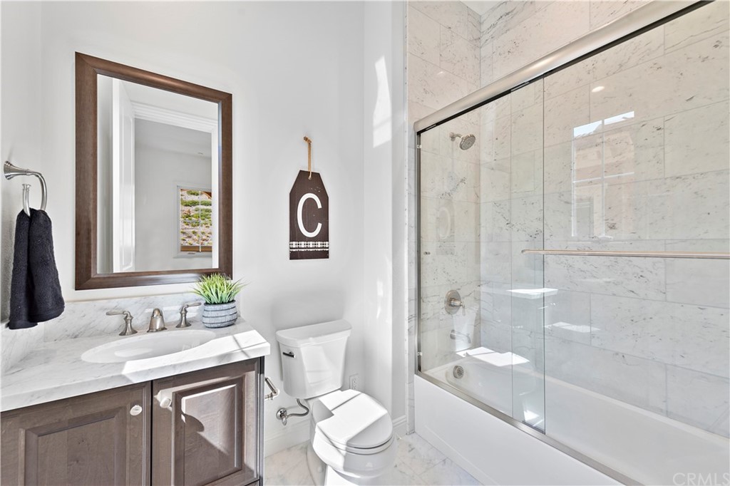 186 Leafy Pass Irvine, CA 92602 - Photo 46 of 59 a bathroom with a granite countertop sink toilet and shower
