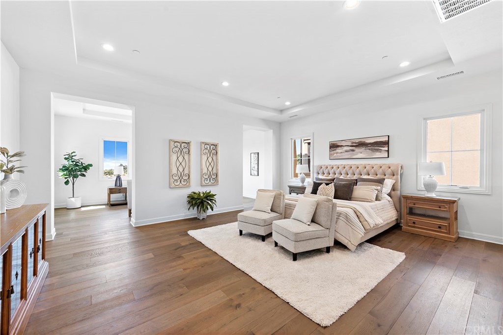 186 Leafy Pass Irvine, CA 92602 - Photo 50 of 59 a living room with furniture and wooden floor