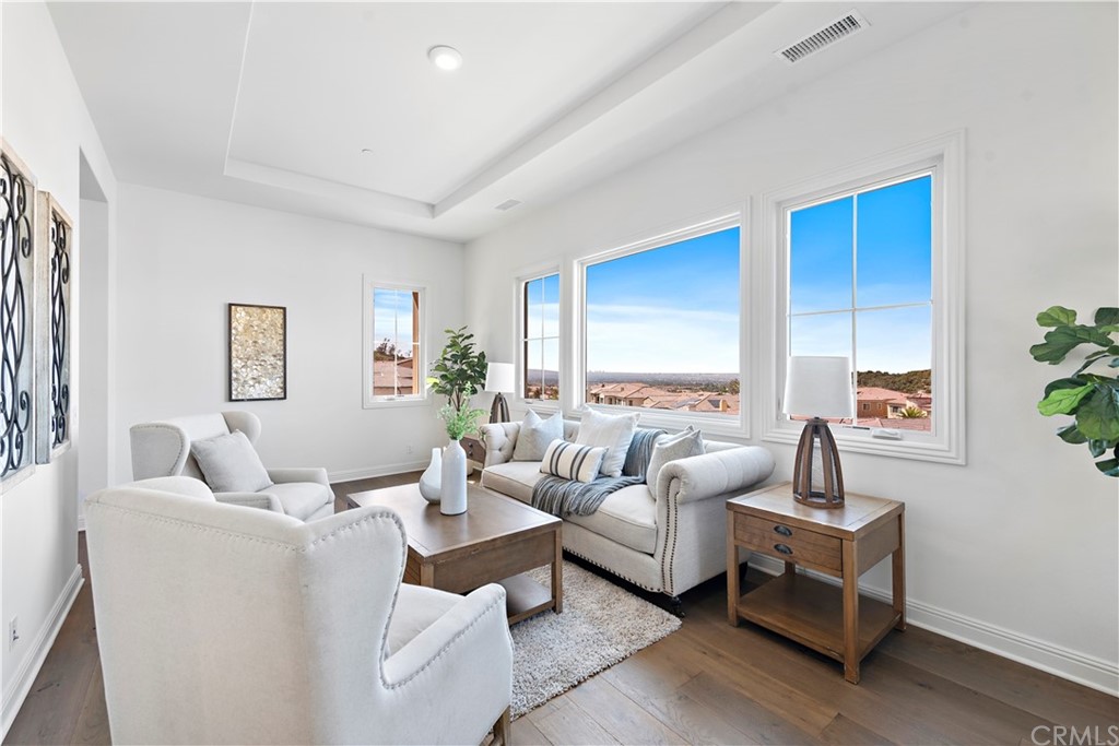 186 Leafy Pass Irvine, CA 92602 - Photo 52 of 59 a living room with furniture and a large window