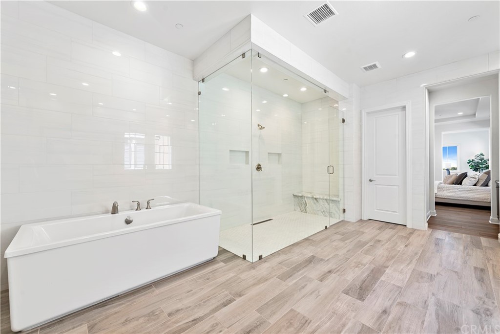 186 Leafy Pass Irvine, CA 92602 - Photo 56 of 59 a spacious bathroom with a double vanity sink a shower and a mirror