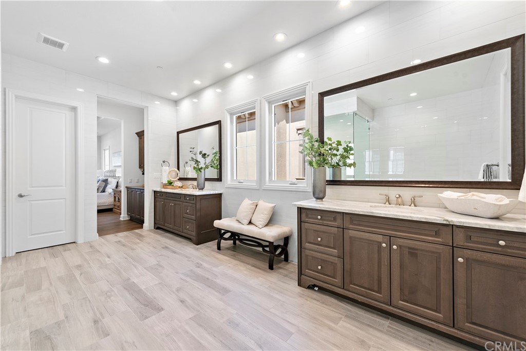 186 Leafy Pass Irvine, CA 92602 - Photo 57 of 59 a spacious bathroom with a double vanity sink a mirror and a shower