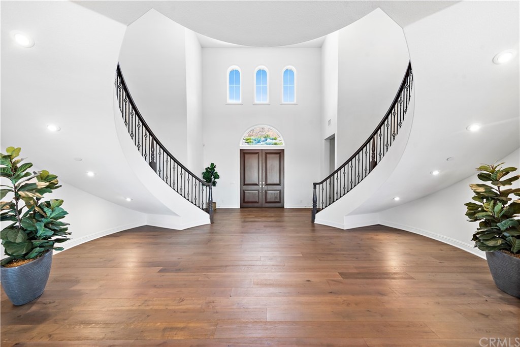 186 Leafy Pass Irvine, CA 92602 - Photo 9 of 59 a view of entryway and hall with wooden floor