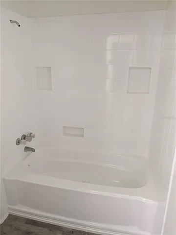 a bathroom with bathtub