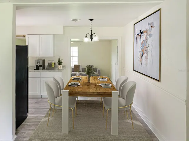 a dining room with furniture and window