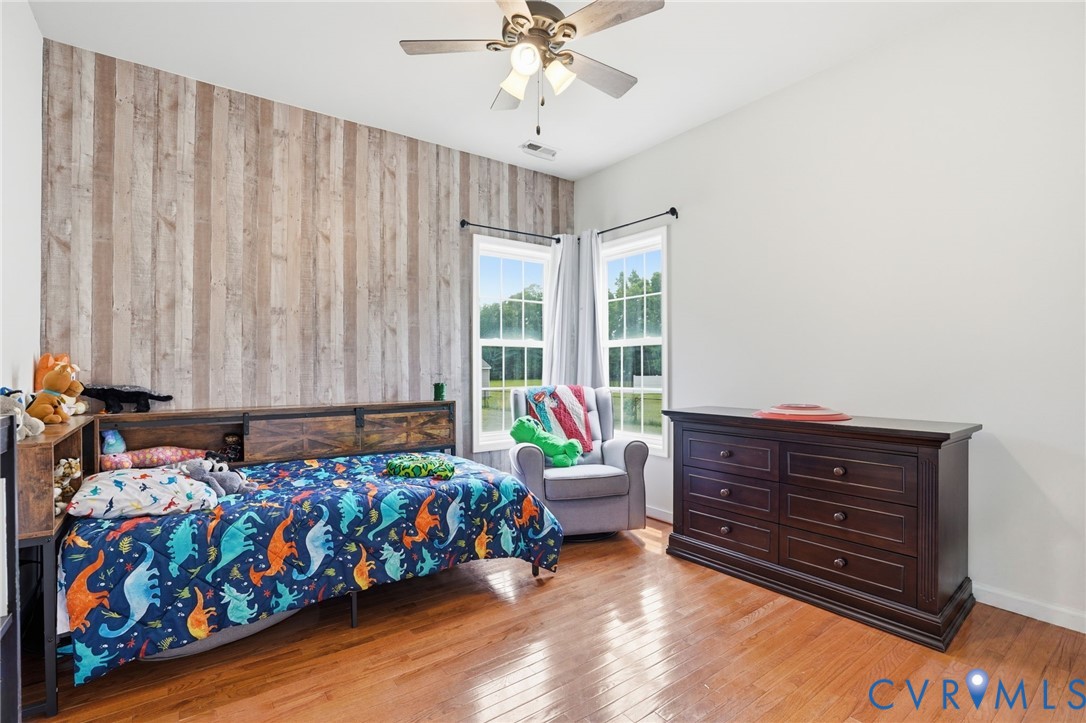 5305 Wellington Ridge Road Richmond, VA 23231 - Photo 44 of 67 Room featuring a wood-finish accent wall, hardwood