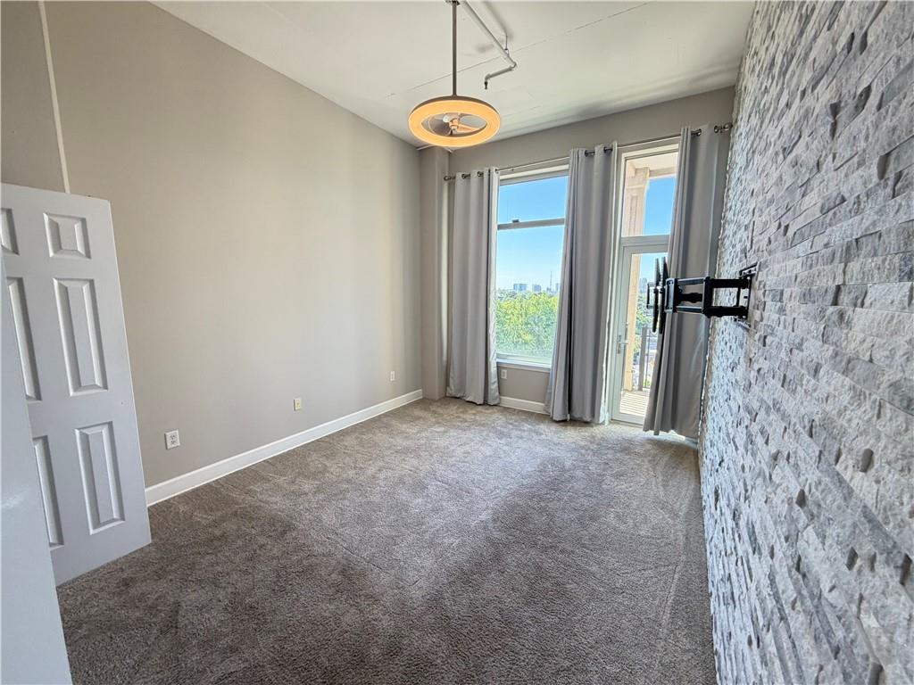 3820 Roswell Road Northeast, Unit 902 Atlanta, GA 30342 - Photo 12 of 20 a view of livingroom with windows