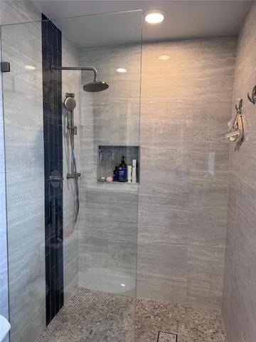 a view of a swimming pool with lounge chair