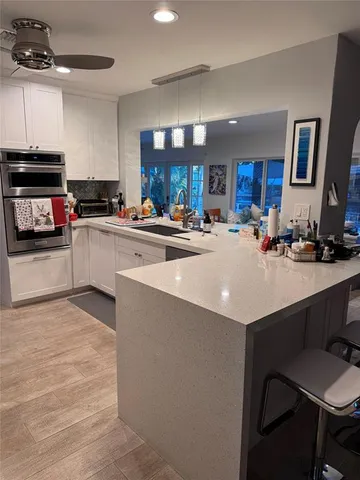 a living room with furniture and a mirror