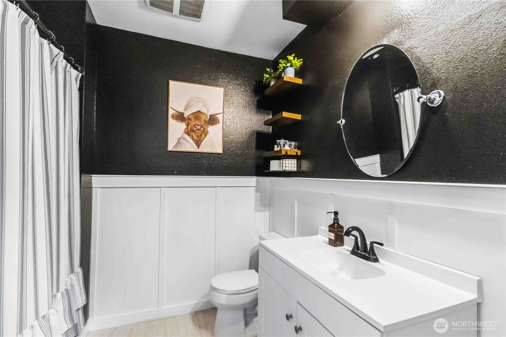 2323 48th Avenue Longview, WA 98632 - Photo 11 of 18 a bathroom with a sink mirror and toilet