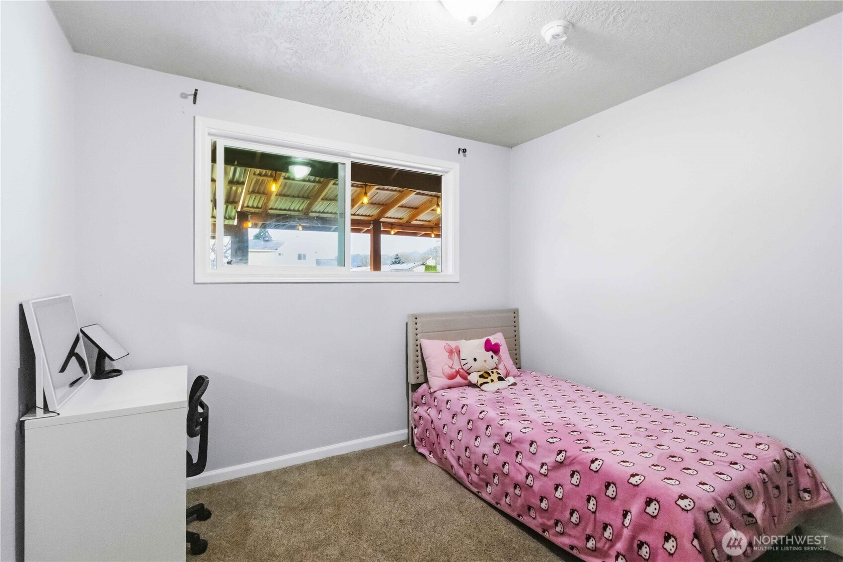 2323 48th Avenue Longview, WA 98632 - Photo 12 of 18 a bedroom with a bed and a window