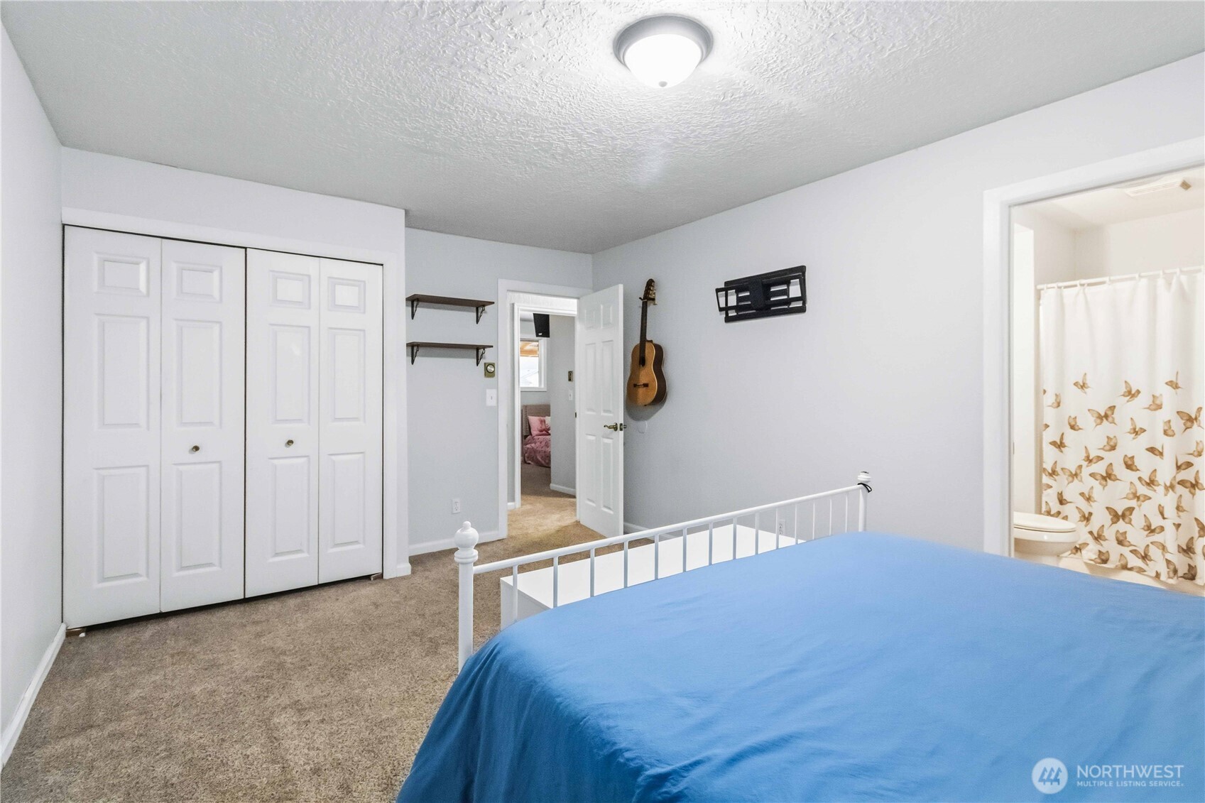 2323 48th Avenue Longview, WA 98632 - Photo 15 of 18 a bedroom with a bed and a window