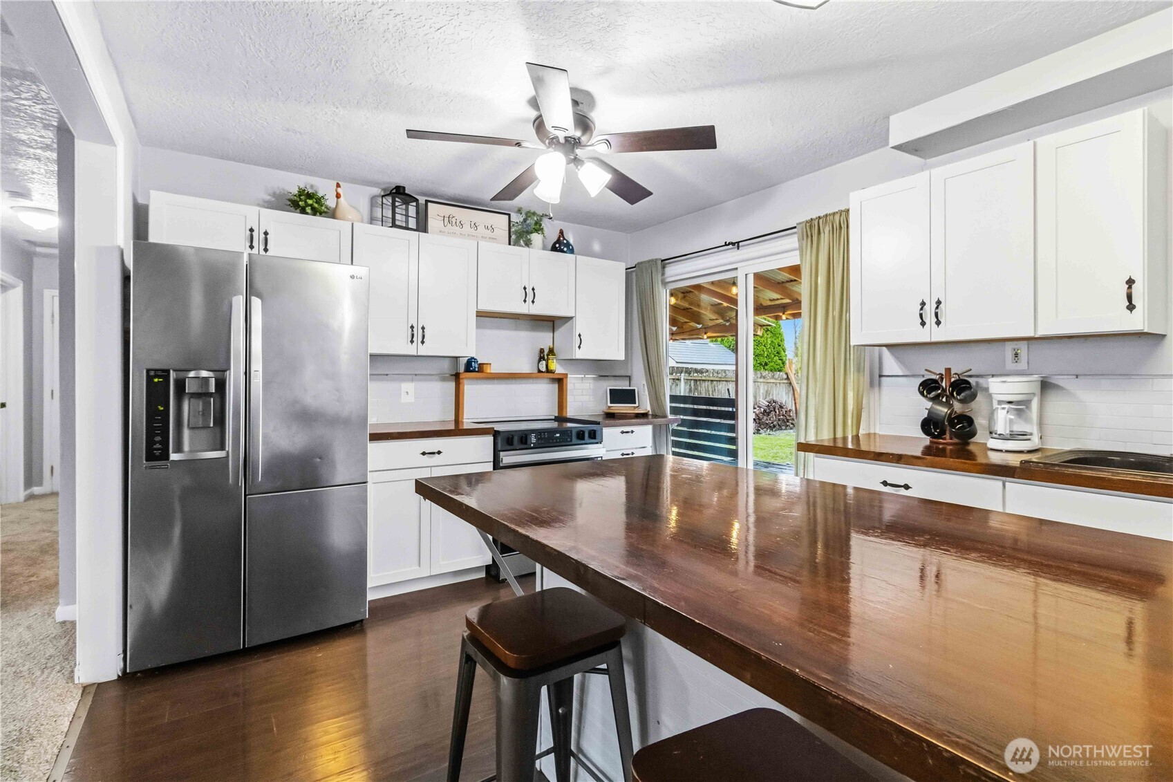 2323 48th Avenue Longview, WA 98632 - Photo 5 of 18 a kitchen with stainless steel appliances granite countertop a refrigerator a sink dishwasher a stove and a refrigerator with wooden floor