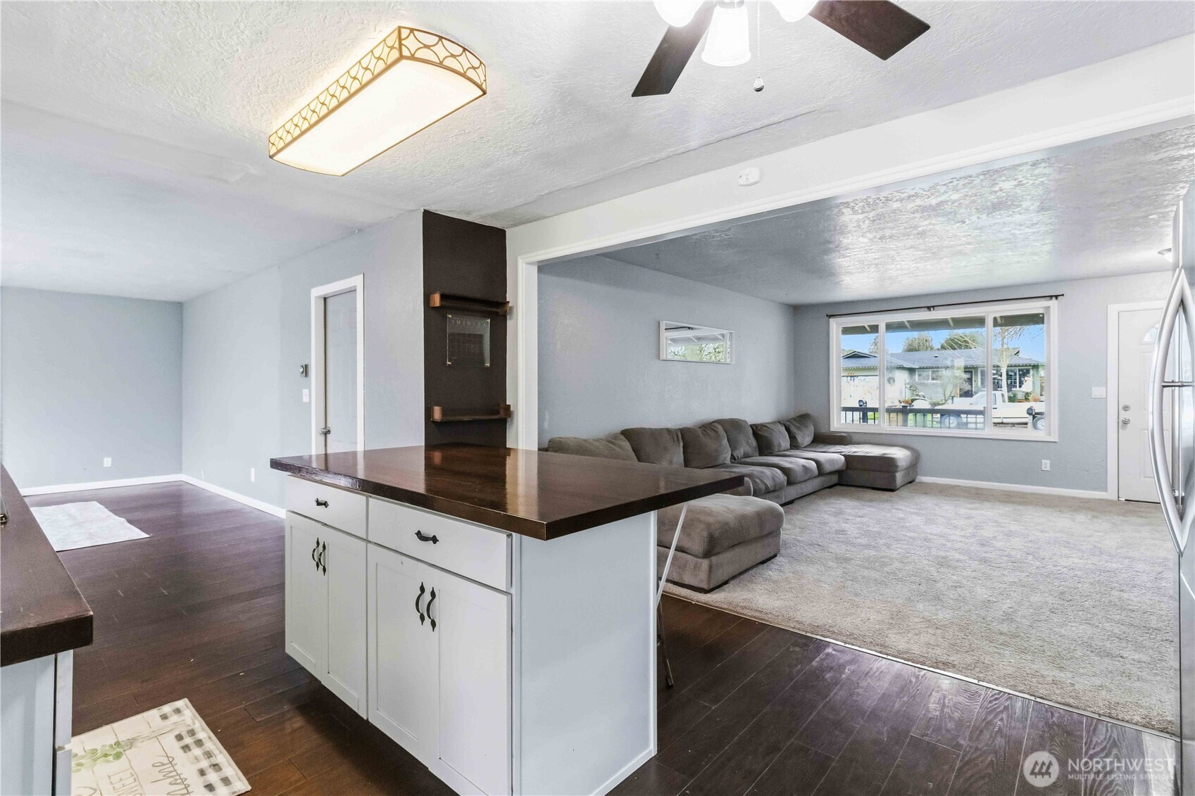 2323 48th Avenue Longview, WA 98632 - Photo 8 of 18 a living room with furniture and a large window