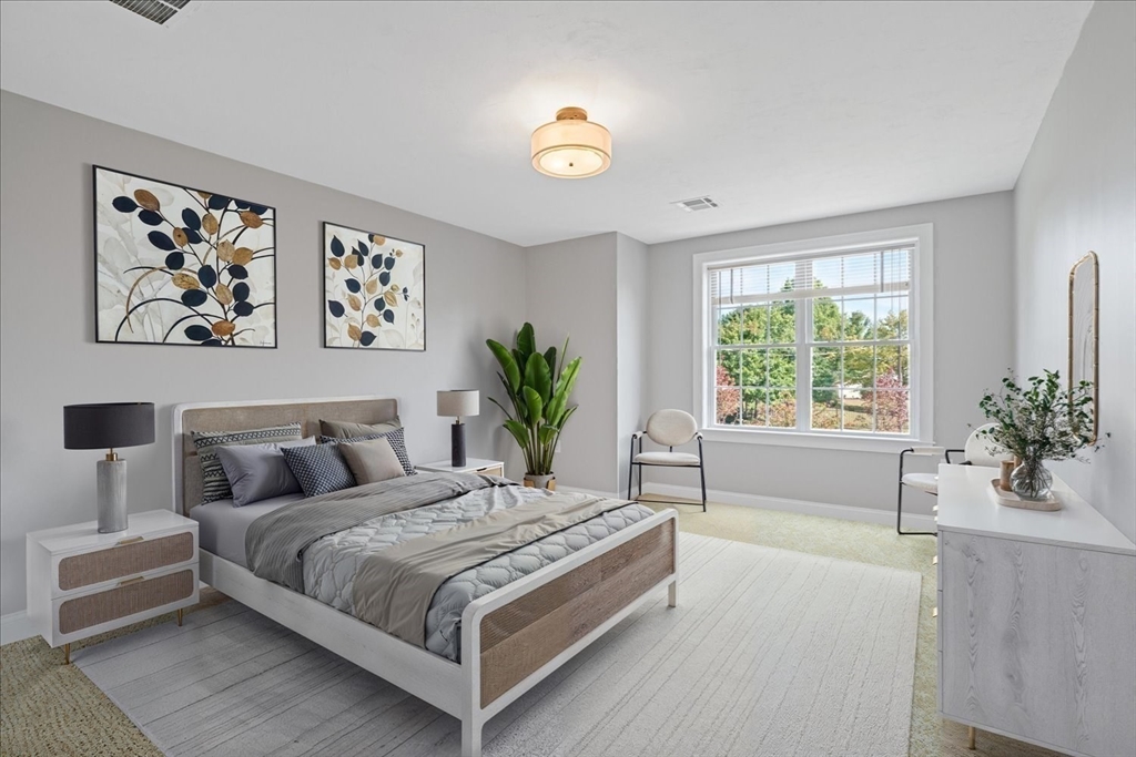 509 Mendon Road, Unit 509 Attleboro, MA 02703 - Photo 17 of 31 a spacious bedroom with a large bed and a window