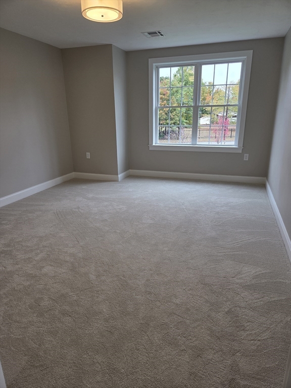 509 Mendon Road, Unit 509 Attleboro, MA 02703 - Photo 18 of 31 an empty room with windows