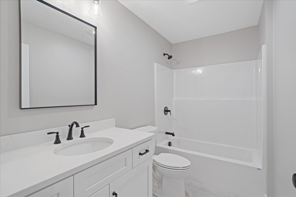 509 Mendon Road, Unit 509 Attleboro, MA 02703 - Photo 20 of 31 a bathroom with a sink a toilet and shower