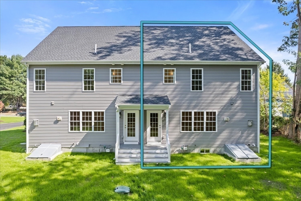 509 Mendon Road, Unit 509 Attleboro, MA 02703 - Photo 24 of 31 front view of a house with a yard