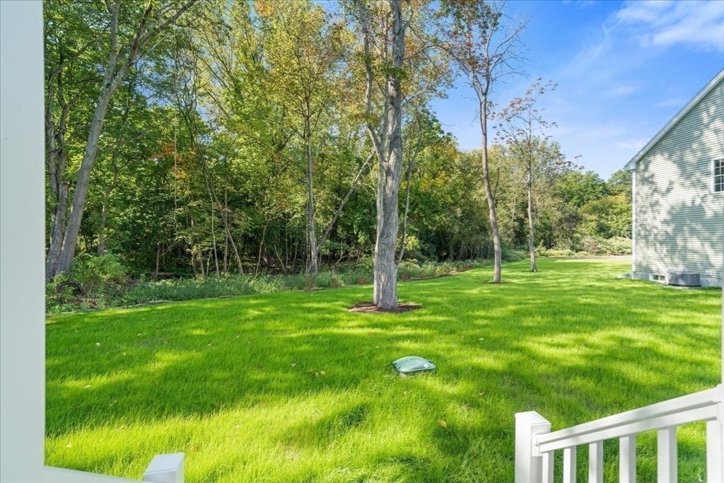 509 Mendon Road, Unit 509 Attleboro, MA 02703 - Photo 26 of 31 a view of a trees with a yard