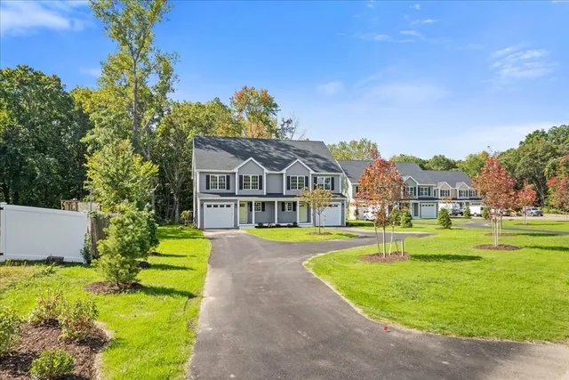 a front view of a house with a yard table and chairs