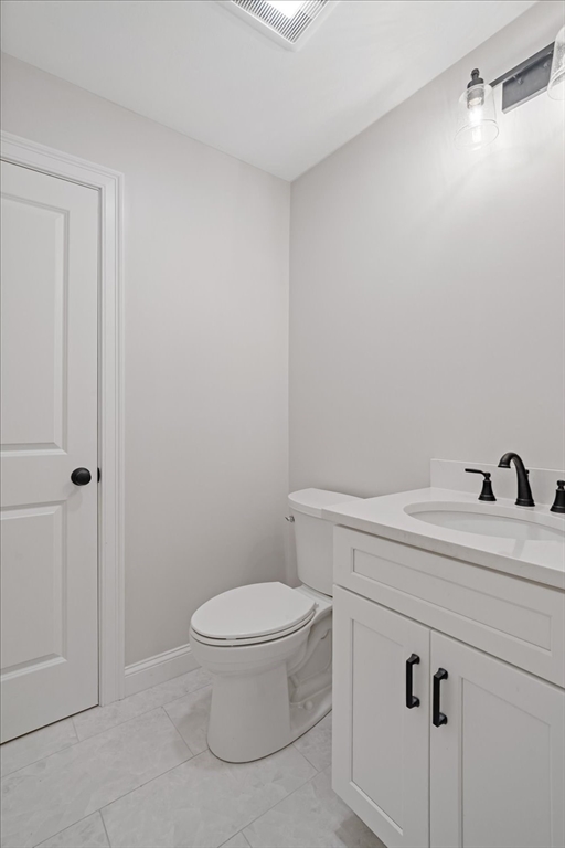 509 Mendon Road, Unit 509 Attleboro, MA 02703 - Photo 7 of 31 a bathroom with a sink a toilet and vanity
