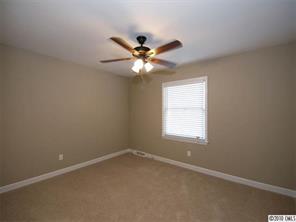 3526 High Ridge Road Charlotte, NC 28270 - Photo 12 of 16 an empty room with a window and a fan