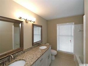 3526 High Ridge Road Charlotte, NC 28270 - Photo 13 of 16 a bathroom with a granite countertop sink and a mirror