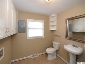 3526 High Ridge Road Charlotte, NC 28270 - Photo 14 of 16 a bathroom with a toilet sink and mirror