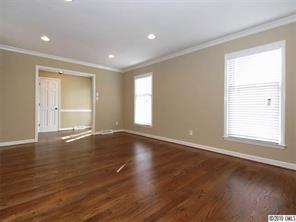 3526 High Ridge Road Charlotte, NC 28270 - Photo 3 of 16 an empty room with wooden floor and windows