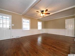 3526 High Ridge Road Charlotte, NC 28270 - Photo 8 of 16 a view of an empty room with window and wooden floor