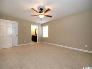 3526 High Ridge Road Charlotte, NC 28270 - Photo 10 of 16 an empty room with chandelier fan and windows