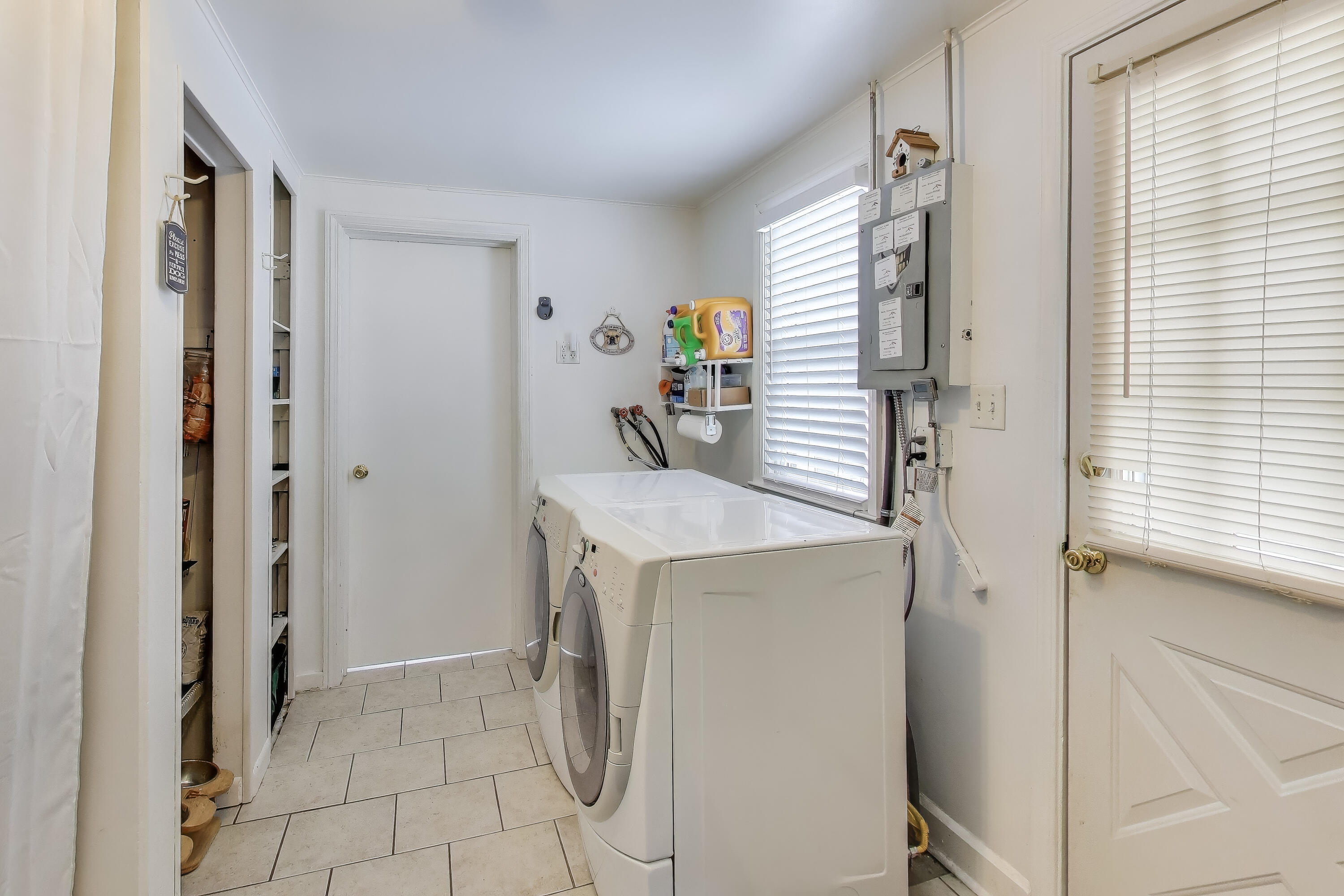 1250 East North Street Crown Point, IN 46307 - Photo 11 of 15 a utility room with cabinets washer and dryer