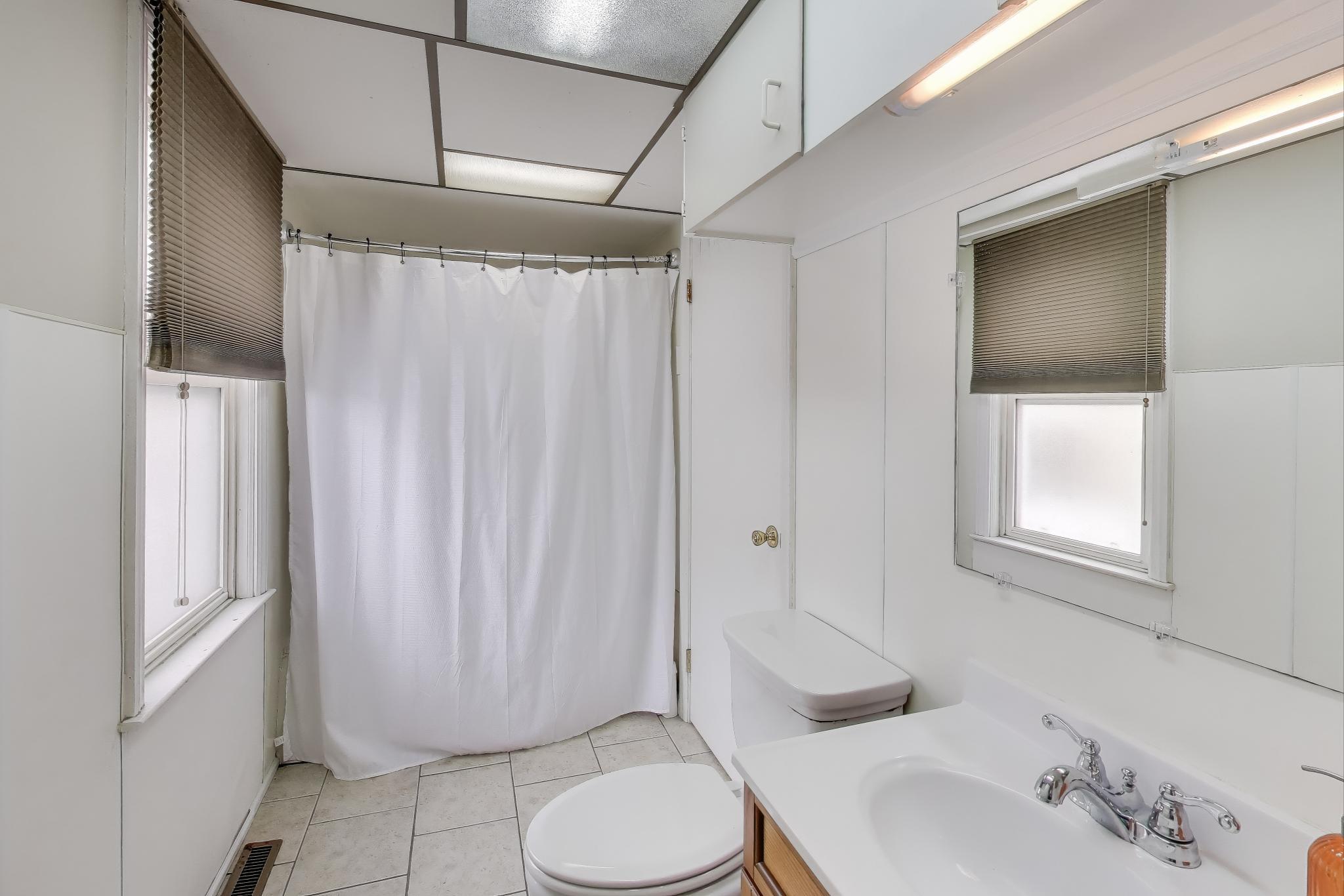 1250 East North Street Crown Point, IN 46307 - Photo 12 of 15 a bathroom with a sink toilet and shower