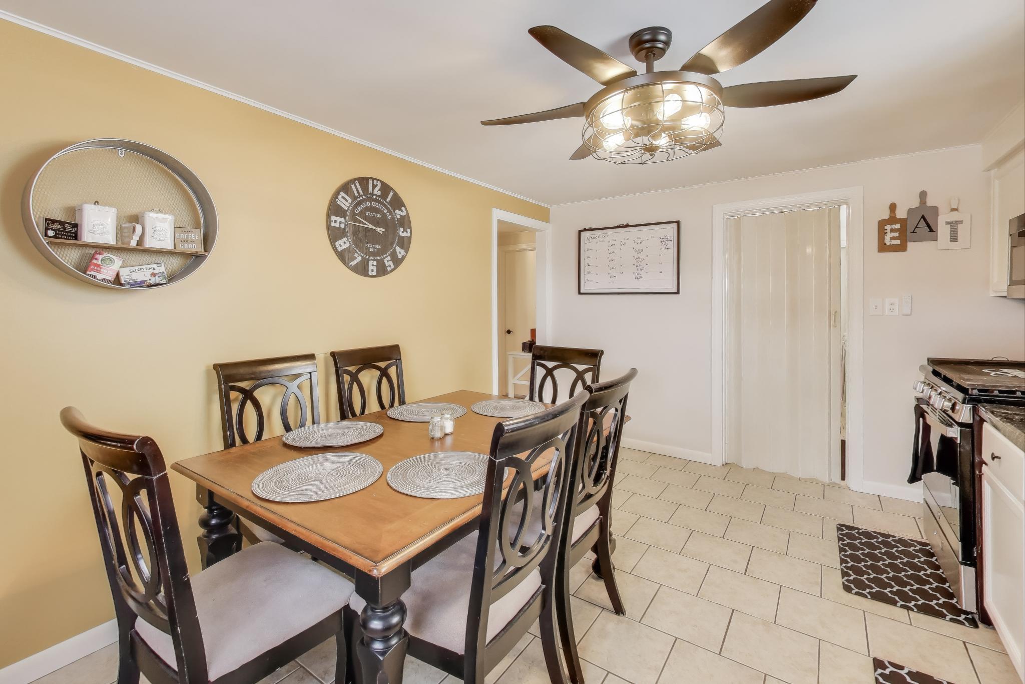 1250 East North Street Crown Point, IN 46307 - Photo 6 of 15 a view of a dining room with furniture and a chandelier