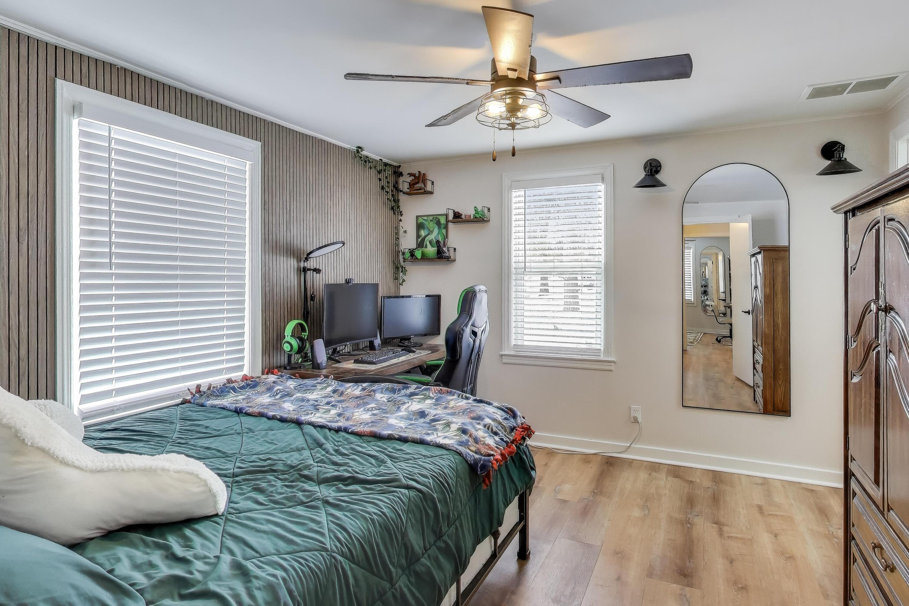 1250 East North Street Crown Point, IN 46307 - Photo 8 of 15 a bedroom that has a bed and a chandelier