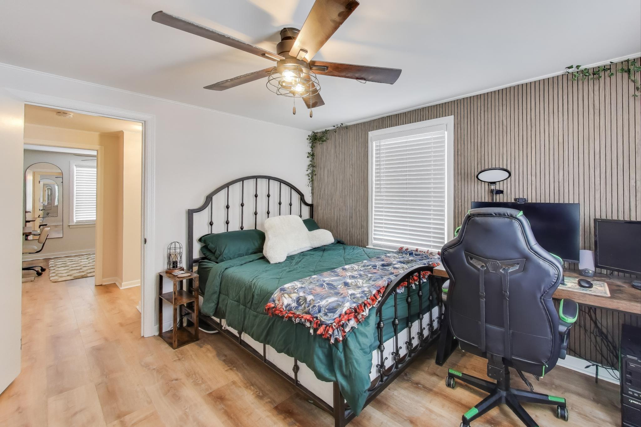 1250 East North Street Crown Point, IN 46307 - Photo 9 of 15 a bedroom with a bed and a chandelier