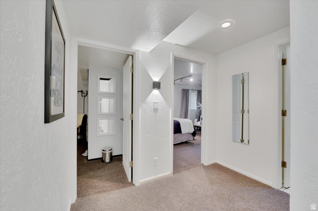 510 Spring Creek Road Providence, UT 84332 - Photo 41 of 97 Carpeted hallway with white walls and overhead recessed lighting
