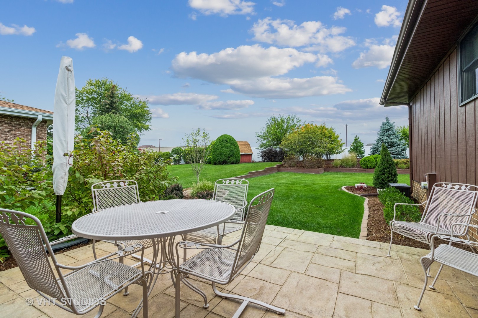 695 Vermont Road Frankfort, IL 60423 - Photo 20 of 20 a view of a table and chairs in backyard