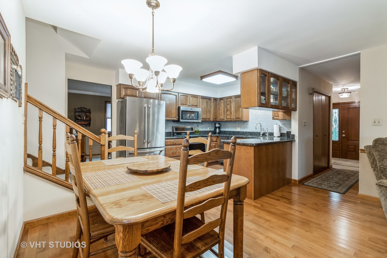 695 Vermont Road Frankfort, IL 60423 - Photo 4 of 20 a dining room filled chandelier and wooden floor