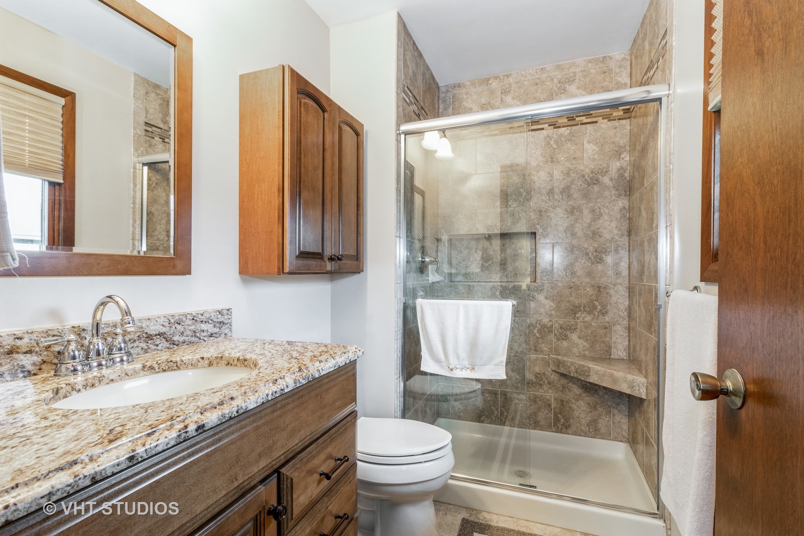 695 Vermont Road Frankfort, IL 60423 - Photo 10 of 20 a bathroom with a granite countertop sink a toilet and shower
