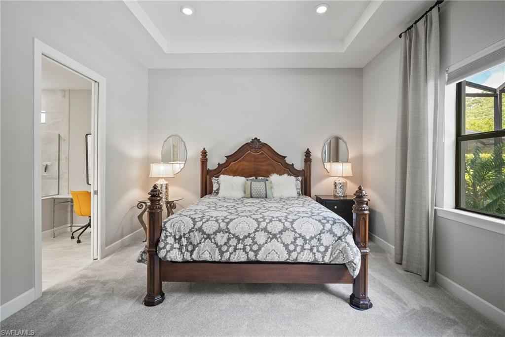 14227 Wild Timber Court Estero, FL 33928 - Photo 12 of 49 a bedroom with a bed a mirror and windows