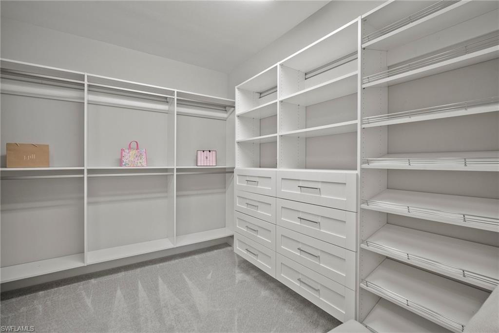 14227 Wild Timber Court Estero, FL 33928 - Photo 19 of 49 a view of an empty walk in closet