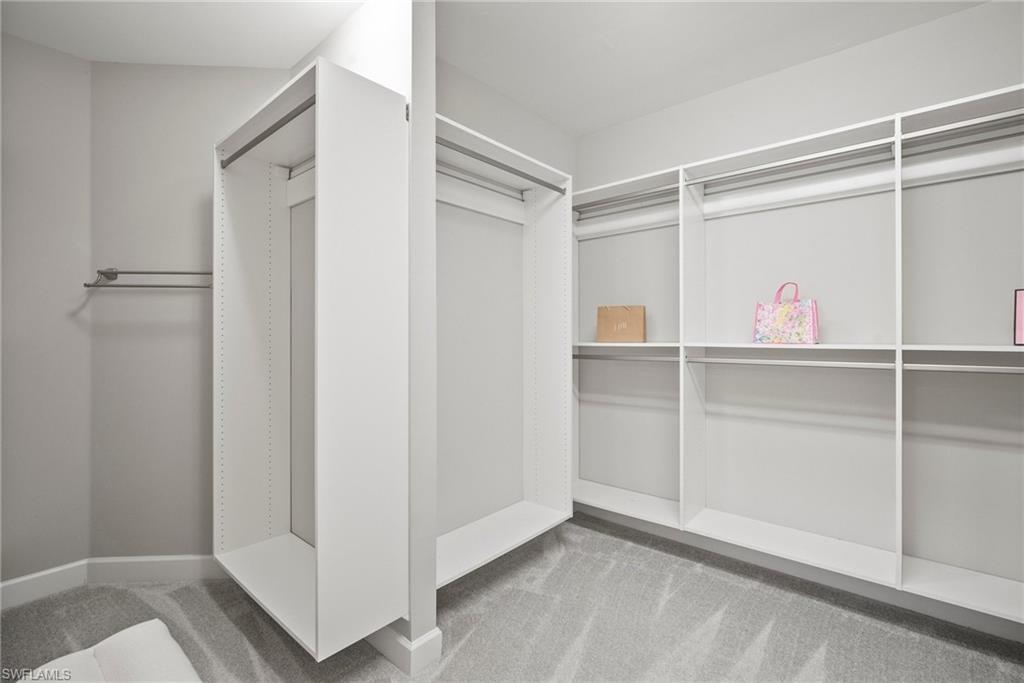 14227 Wild Timber Court Estero, FL 33928 - Photo 20 of 49 a view of an empty walk in closet