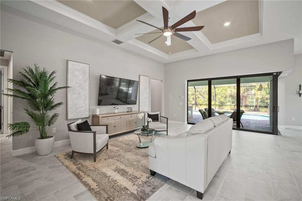 14227 Wild Timber Court Estero, FL 33928 - Photo 22 of 49 a living room with furniture and a flat screen tv