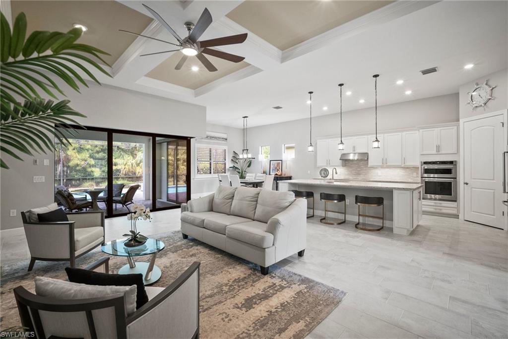 14227 Wild Timber Court Estero, FL 33928 - Photo 23 of 49 a living room with furniture kitchen view and a large window